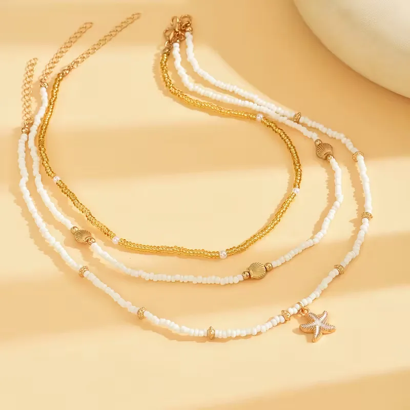 Ketting met schelp en ster - Image 3